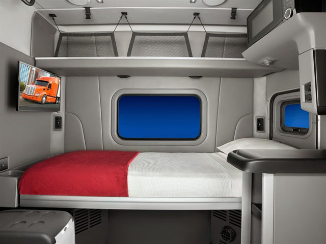 This figure is an interior photo of the sleeping compartment of a modern sleeper cab tractor.